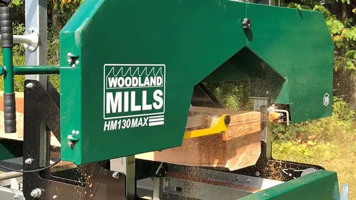 close up of ripper37 sawmill blade on green woodland mills saw mill